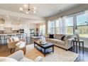 Spacious living room with large windows, flowing into the dining and kitchen area at 11144 Limehurst Pl, Charlotte, NC 28278
