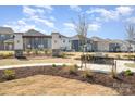 Well-maintained community green space featuring benches and manicured landscaping at 15616 Parkside Crossing Dr, Charlotte, NC 28278