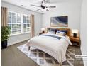 Inviting bedroom featuring a large window, ceiling fan, and cozy furnishings at 1638 Pineburr Ln, Rock Hill, SC 29730