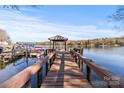 Waterfront view of private dock, gazebo, and boat slip on the lake, perfect for outdoor living at 1657 Bowater Rd, Rock Hill, SC 29732