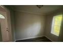 Neutral room showcasing a freshly painted interior and a bright window at 2312 Tate St, Charlotte, NC 28216
