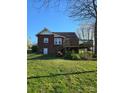 Image of a wooden deck with stairs in the backyard and a grassy lawn at 307 Gold Hill Ave, Rockwell, NC 28138