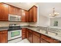 Kitchen showcasing stainless steel appliances and beautiful wood cabinets at 321 Rose Garden Ct, Rock Hill, SC 29732