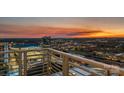 Enjoy beautiful city views from the balcony; the perfect location for entertaining guests and watching sunsets at 333 W Trade St # 2704, Charlotte, NC 28202
