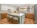 A stylish kitchen offers a large island, stainless appliances, and lots of storage at 3614 Champaign St, Charlotte, NC 28210