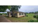 Charming home with black shutters and ample windows allowing natural light to fill the interior spaces at 403 Branch St, Kings Mountain, NC 28086