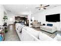 Spacious living room with wood floors, and neutral-colored sofas offering a relaxing ambiance at 4213 Stockbrook Dr, Charlotte, NC 28215