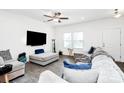 Bright living room with a large window, and light colored sofas creating a relaxing atmosphere at 4213 Stockbrook Dr, Charlotte, NC 28215