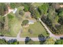 Aerial view showcasing the home's large lot, surrounded by mature trees and lush greenery at 574 Pamela Rd, York, SC 29745
