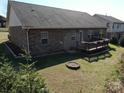 Home backyard with wooden deck, lawn, and room for outdoor entertaining at 7283 Bradberry Ln, Denver, NC 28037