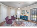 Elegant living room with hardwood floors, stylish furnishings, and an eye-catching chandelier at 820 N Main St, Salisbury, NC 28144