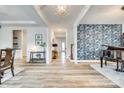 Spacious foyer with hardwood flooring, designer wallpaper and elegant decor at 822 Flatwater Ct, Fort Mill, SC 29708
