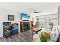 Comfortable living room featuring a fireplace, TV, and stylish decor at 11615 Hidden Grove Trl, Charlotte, NC 28215