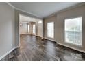 Bright living room boasts laminate floors, large windows, and neutral paint at 1240 Periwinkle Dr, Waxhaw, NC 28173