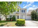 Charming two-story home with a well-manicured lawn and attached two-car garage at 15619 Lakepoint Forest Dr, Charlotte, NC 28278