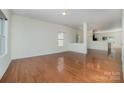 Open concept living room with hardwood floors, bright and airy space at 15619 Lakepoint Forest Dr, Charlotte, NC 28278