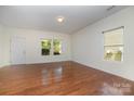 Bright and airy living room with hardwood floors and ample natural light at 15619 Lakepoint Forest Dr, Charlotte, NC 28278
