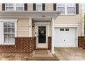 Charming home featuring a brick facade, attached garage, and a welcoming front entrance at 2011 Dunsmore Ln # 137, Waxhaw, NC 28173