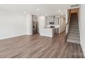 Open-concept kitchen featuring stainless steel appliances and grey cabinets at 2070 Old Rivers Rd, Concord, NC 28027
