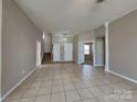 Spacious living room features tile flooring and lots of natural light at 2122 Shumard Cir, Indian Trail, NC 28079