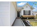 Inviting front entrance with neat landscaping and charming details, showcasing the home's welcoming curb appeal at 2425 Barkers Ridge Dr, Bessemer City, NC 28016