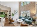 Bright living room with high ceilings, a large window, and modern furnishings at 2529 Daniel St, Charlotte, NC 28205