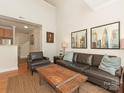 Inviting living room with high ceilings, comfortable leather seating, and stylish decor at 301 E Tremont Ave, Charlotte, NC 28203