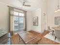 Bright living room with a large window and a view into the dining area at 301 E Tremont Ave, Charlotte, NC 28203