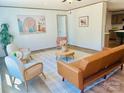 Bright living room with stylish furnishings, including a leather sofa and accent chairs at 3144 Rickwood Dr, Newton, NC 28658