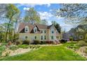 Charming home with lush front lawn, mature trees, and a well-manicured garden; perfect for suburban living at 3717 Bodenham Ct, Charlotte, NC 28215
