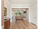 Inviting living room featuring wood beams, stone fireplace, and hardwood floors at 406 Sugar Maple Ln, Weddington, NC 28104