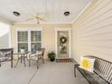 Cozy front porch with chairs, welcome mat and decor at 4434 Patriots Hill Rd, Mint Hill, NC 28227