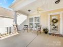 Inviting front porch with seating and decorative touches at 4434 Patriots Hill Rd, Mint Hill, NC 28227
