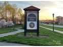 Brighton Park community sign at sunset with flowering trees at 4434 Patriots Hill Rd, Mint Hill, NC 28227