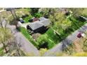 Aerial view of a home on a corner lot with mature trees and lush landscaping at 501 Eastwood Dr, Gastonia, NC 28054