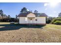 A charming single-story home features a classic design and a well-maintained yard at 6441 Highway 73 W Hwy, Mount Gilead, NC 27306