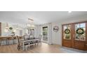 Inviting dining area with a modern chandelier, wood floors, and bright natural light at 845 2Nd Nw St, Hickory, NC 28601