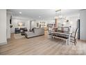 Open-concept living space with wood floors, neutral colors, and plenty of natural light, ideal for modern living at 845 2Nd Nw St, Hickory, NC 28601