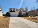 Inviting home with well-kept landscaping, attractive stone accents, and attached garage at 86614 Arrington Rd, Lancaster, SC 29720