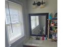 Cozy bathroom featuring a large mirror and a light fixture above the sink at 1011 Buick Ave, Kannapolis, NC 28083