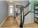 Welcoming foyer with wood floors and stairs leading to the second level at 1021 Glen Laurel Dr, Fort Mill, SC 29707
