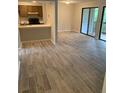 Spacious open living room and kitchen area with access to a deck through sliding glass doors at 11022 Harrowfield Rd, Charlotte, NC 28226