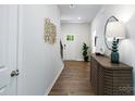 Inviting entryway featuring hardwood floors, elegant decor, and a stylish console table at 146 Falling Up Ln, Salisbury, NC 28147