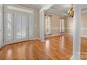 Elegant dining room showcasing hardwood floors, detailed trim work, chandelier and natural light at 153 Stafford Estates Dr, Salisbury, NC 28146