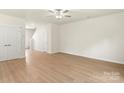 Spacious living room with light wood floors, white walls, and ample natural light at 1530 Doran Ter, Richburg, SC 29729