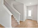 Inviting entryway with light wood floors and a staircase at 1564 Doran Ter, Richburg, SC 29729
