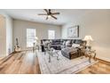 Spacious living room with hardwood flooring, a plush sectional, and an area rug at 2023 Aragon Ln, Gastonia, NC 28056
