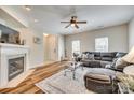 Comfortable living space featuring a fireplace, wood floors, and a large sofa at 2023 Aragon Ln, Gastonia, NC 28056