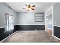 Living room with carpet, two toned walls, and window with curtains at 203 Jackson St, Fort Mill, SC 29715