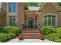 Inviting brick entryway with stairs, landscaping, and a beautiful front door creates a welcoming first impression at 310 Berkeley Rd, Rock Hill, SC 29732